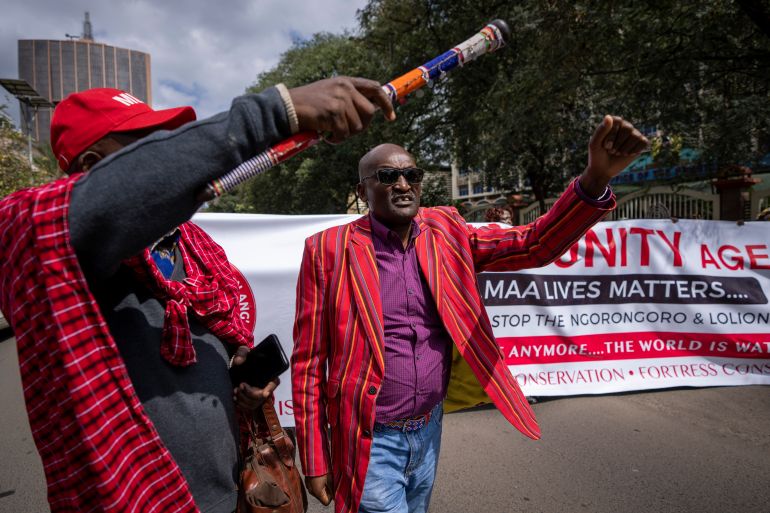 FILE - Maasai rights activists from the Maa Unity Agenda group march to protest outside the Tanzanian high commission in downtown Nairobi, Kenya on June 17, 2022. The East African Court of Justice on Friday, Sept. 30, 2022 dismissed a case by Maasai herders who tried to stop Tanzania's government from evicting them from land they have used for generations. (AP Photo/Ben Curtis, File)