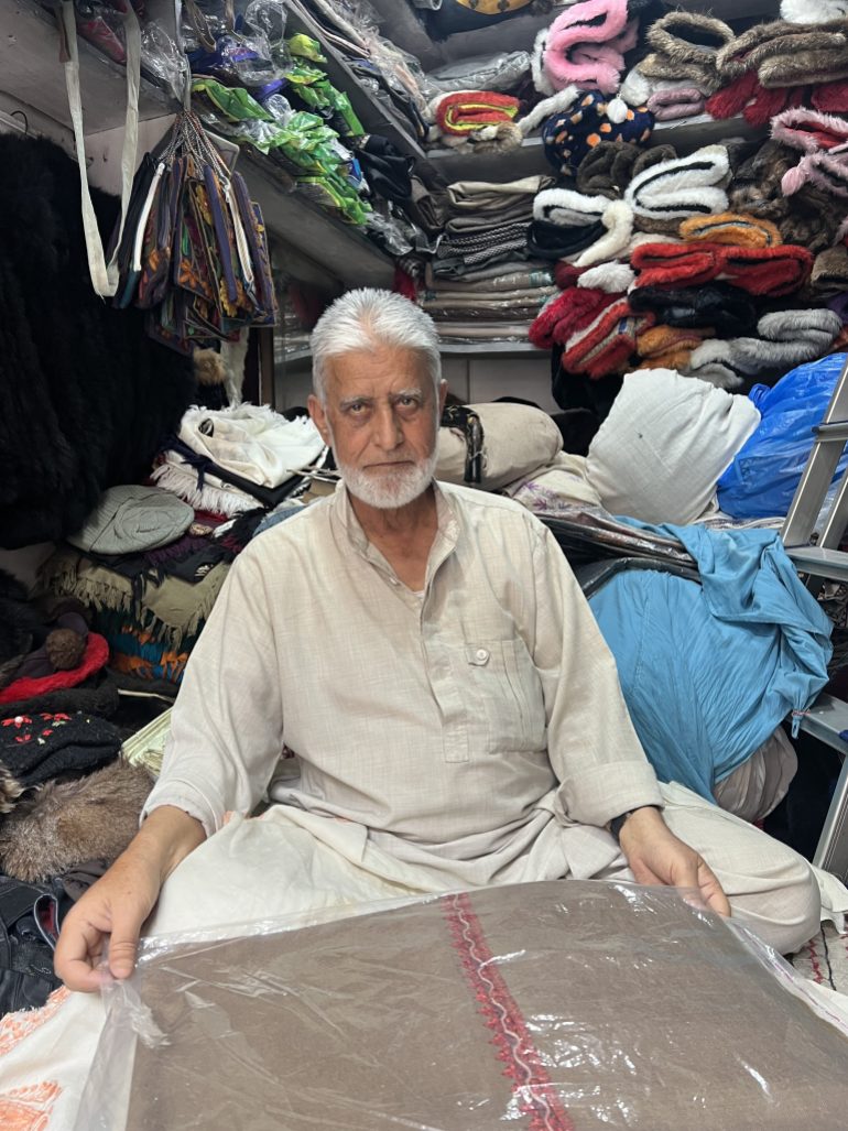 Ghulam Muhammad, a shopkeeper in the locality of Koker Bazar who sells Kashmiri shawls for more than three decades