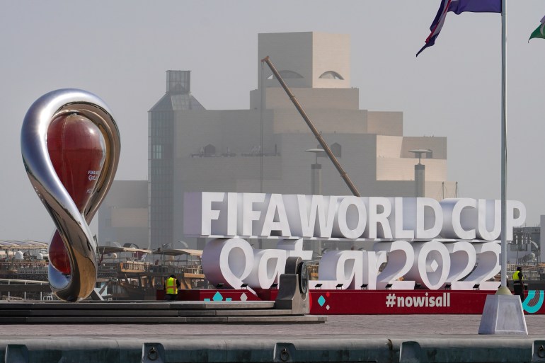 A FIFA World Cup Qatar 2022 logo is seen in front of the Museum of Islamic Art in Doha, Qatar.