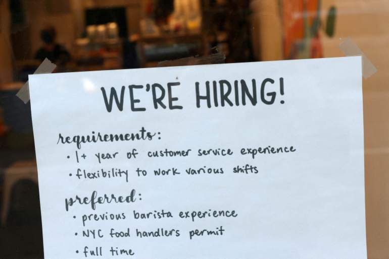 A hiring sign is seen in a cafe in New York City, U.S.
