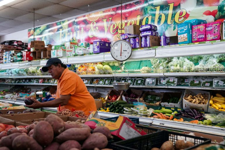 A man shops for produce at Best World Supermarket in the Mount Pleasant neighborhood of Washington, D.C., U.S