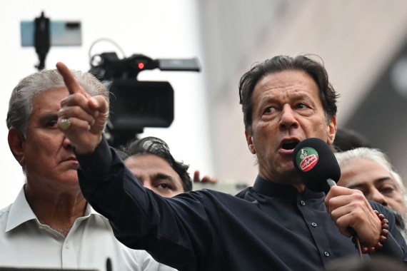 Pakistan's former prime minister Imran Khan (R) addresses his supporters during an anti-government march towards capital Islamabad, demanding early elections, in Gujranwala on November 1, 2022. (Photo by Arif ALI / AFP)
