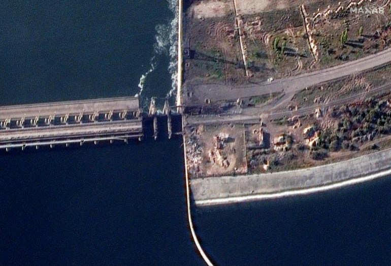 This handout satellite image released and collected by Maxar Technologies on November 11, 2022 shows a damaged section of Nova Kakhovka dam, Kherson region.