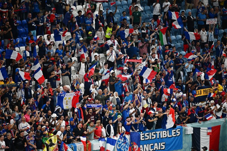 French fans celebrate in the stands.