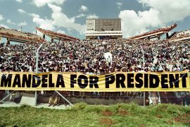 A crowd of some 40.000 African National Congress (ANC) supporters listen to an address by Nelson Mandela at a rally in Mafikeng, South Africa, 1994 [File: Walter Dhladhla/AFP]