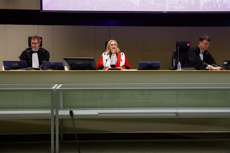 Chairwoman of the court Laurence Massart (C) speaks at the opening in the courtroom prior to the selection of the jury for the 2016 Brussels and Maelbeek attacks trial at the Justitia building in Brussels