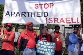 South Africans protest outside the U.S. embassy to condemn Washington's