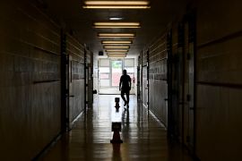 a teacher walks in a hallway in an Ontario school