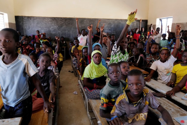 Schoolchildren who fled from attacks of armed militants in Sahel region attend a class in Dori, Burkina Faso