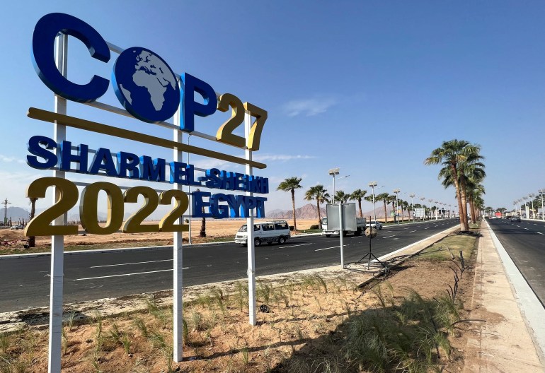 FILE PHOTO: View of a COP27 sign on the road leading to the conference area in Egypt's Red Sea resort of Sharm el-Sheikh town as the city prepares to host the COP27 summit next month, in Sharm el-Sheikh, Egypt October 20, 2022.