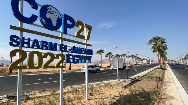 View of a COP27 sign on the road leading to the conference area in Egypt's Red Sea resort.