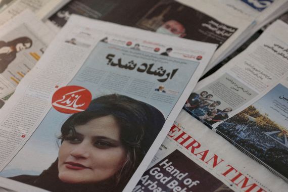 Newspapers showing Mahsa Amini