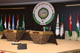 Algerian President Abdelmadjid Tebboune and Arab League Secretary General Ahmed Aboul Gheit attend a session of the Arab League summit.