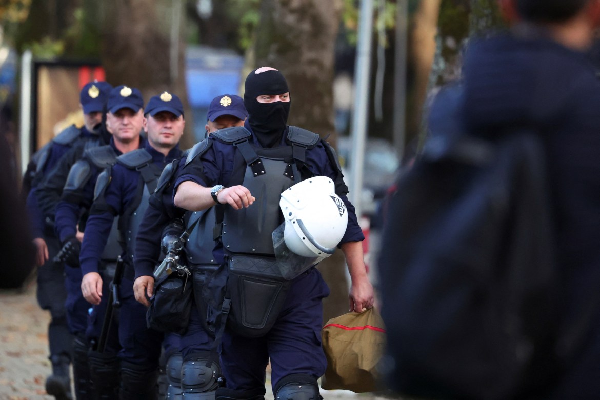 Riot police walk outside Prime Minister Edi Rama's office ahead of an anti-government protest