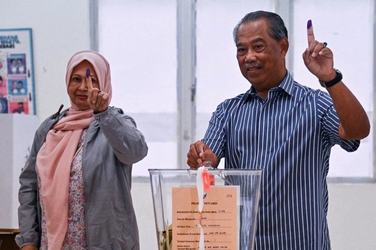 Former Malaysia Prime Minister and Perikatan Nasional chairman Muhyiddin Yassin and his wife Noorainee Abdul Rahman