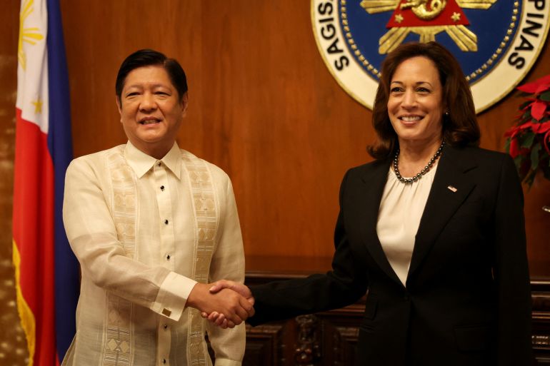 Ferdinand Marcos Jr and Kamaka Harris shaking hands as they meet in Manila. Both are smiling and look happy