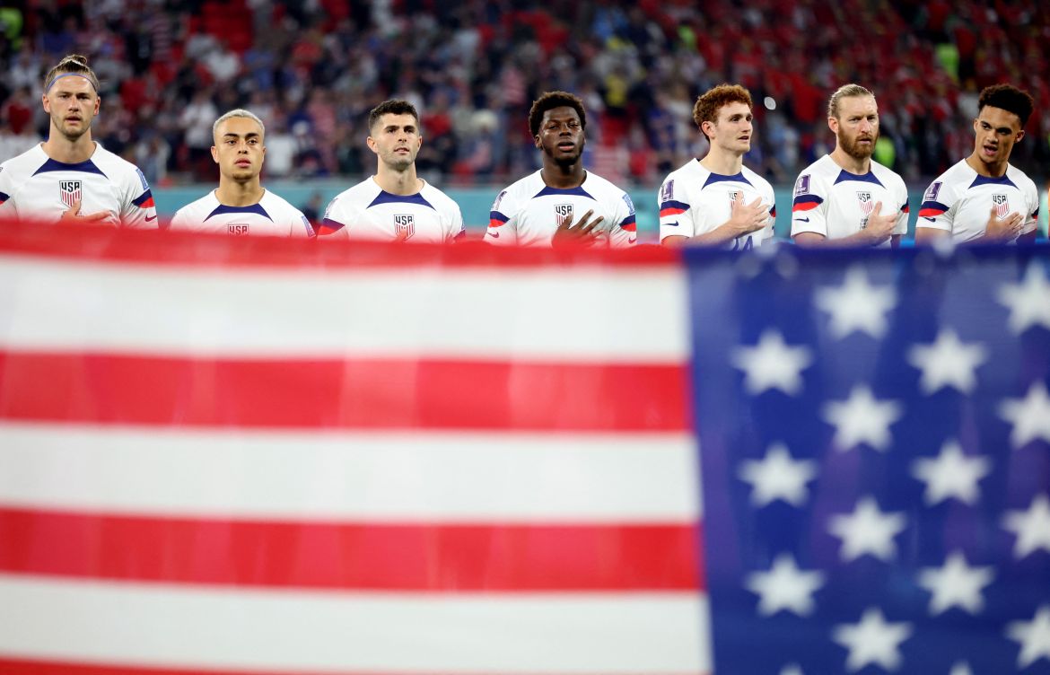American players stand for the national anthem