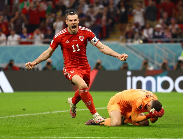 Gareth Bale celebrates scoring Wales's first goal.