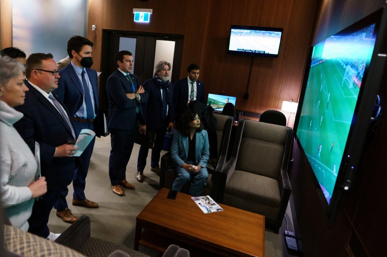Canada's Prime Minister Justin Trudeau watches Canada's first World Cup match
