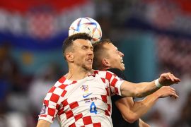 Croatia's Ivan Perisic in action with Canada's Alistair Johnston