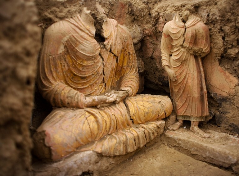 This photograph made on Tuesday, Oct. 12, 2010 shows ancient Buddha statues inside a temple in Mes Aynak, south of Kabul, Afghanistan. This archaeological site is located at the world's second-largest unexploited copper mine in Logar province. The Chinese government-backed mining company, China Metallurgical Group Corp., which won the contract to exploit the site, has given archaeologists three years to finish the excavations. (AP Photo/Dusan Vranic)