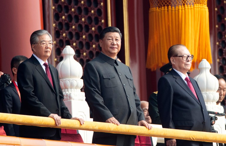 Chinese President Xi Jinping, center, with former presidents Jiang Zemin, right, and Hu Jintao, left, attend the celebration to commemorate the 70th anniversary of the founding of Communist China in Beijing, Tuesday, Oct. 1, 2019. (AP Photo/Ng Han Guan)