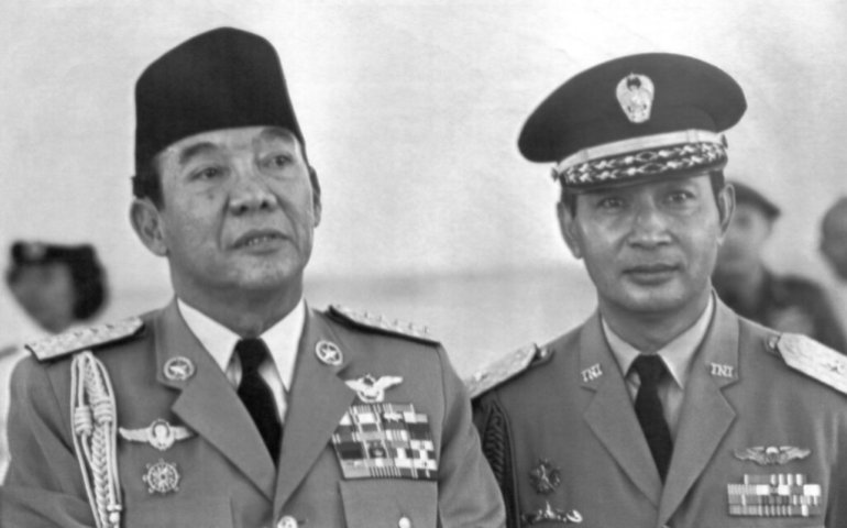 Indonesian President Sukarno (left) and Lieutenant General. Suharto (right) are shown together as they attended a military ceremony in Jakarta in 1965 [File: AP]