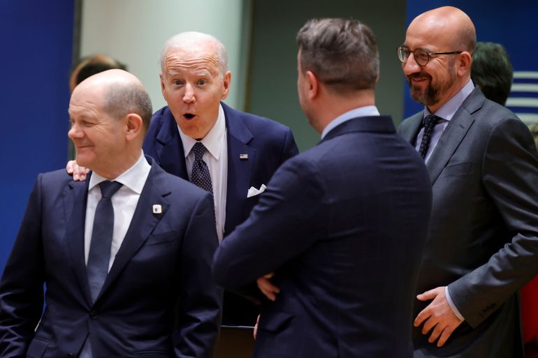 U.S. President Joe Biden, center, speaks with from left, German Chancellor Olaf Scholz, Luxembourg's Prime Minister Xavier Bettel and European Council President Charles Michel during a round table meeting at an EU summit in Brussels, Thursday, March 24, 2022. As the war in Ukraine grinds into a second month, President Joe Biden and Western allies are gathering to chart a path to ramp up pressure on Russian President Vladimir Putin while tending to the economic and security fallout that's spreading across Europe and the world. (AP Photo/Olivier Matthys)
