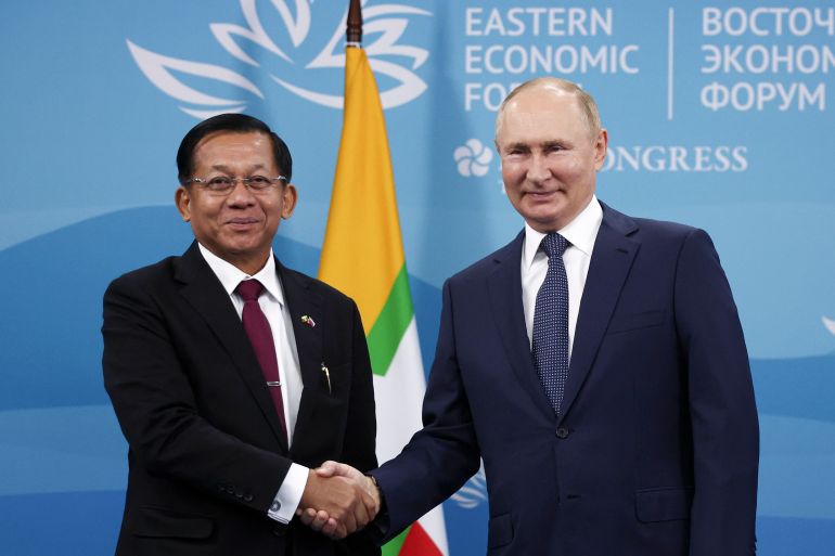 Russian President Vladimir Putin, right, and Myanmar State Administration Council Chairman Senior General Min Aung Hlaing pose for a photo during their meeting on the sideline of the Eastern Economic Forum in Vladivostok, Russia.