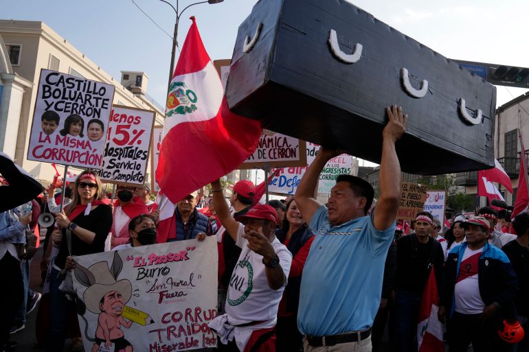 Anti-government protesters demonstrate near the government palace, in Lima, Peru, Saturday, Nov. 5, 2022. (AP Photo/Martin Mejia)
