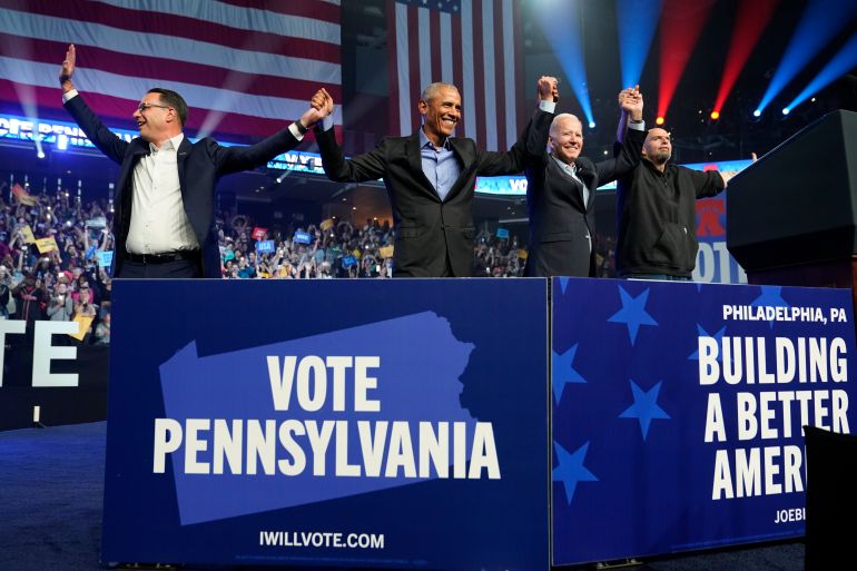 Pennsylvania Democratic gubernatorial candidate Josh Shapiro, former President Barack Obama, President Joe Biden and Democratic Senate candidate John Fetterman hold hands high at a campaign rally in Philadelphia, Pennsylvania.