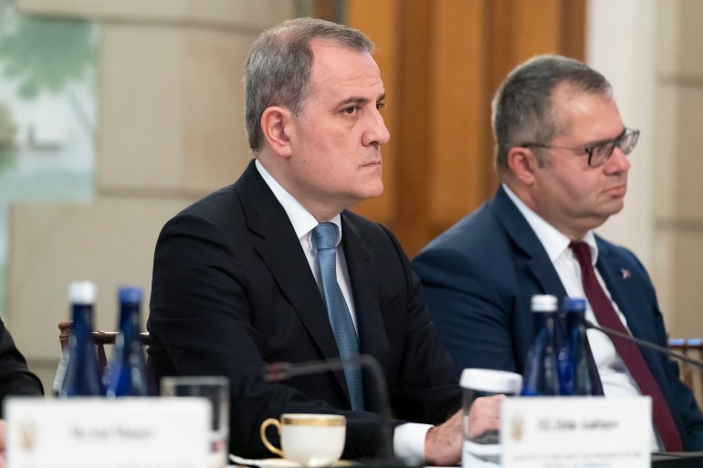 Azerbaijan's Foreign Minister Jeyhun Aziz oglu Bayramov, left, listens during a meeting with Secretary of State Antony Blinken and and Armenia's Foreign Minister Ararat Mirzoyan