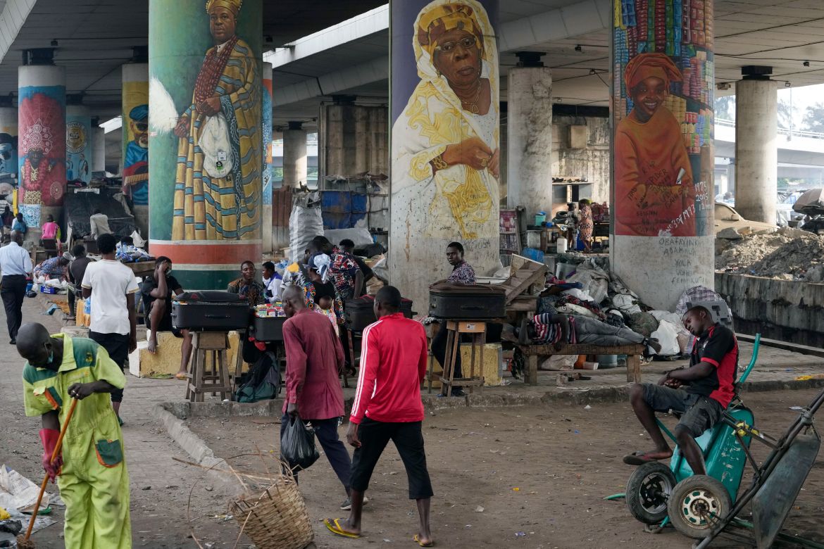 People walk during rush hours in Lagos, Nigeria