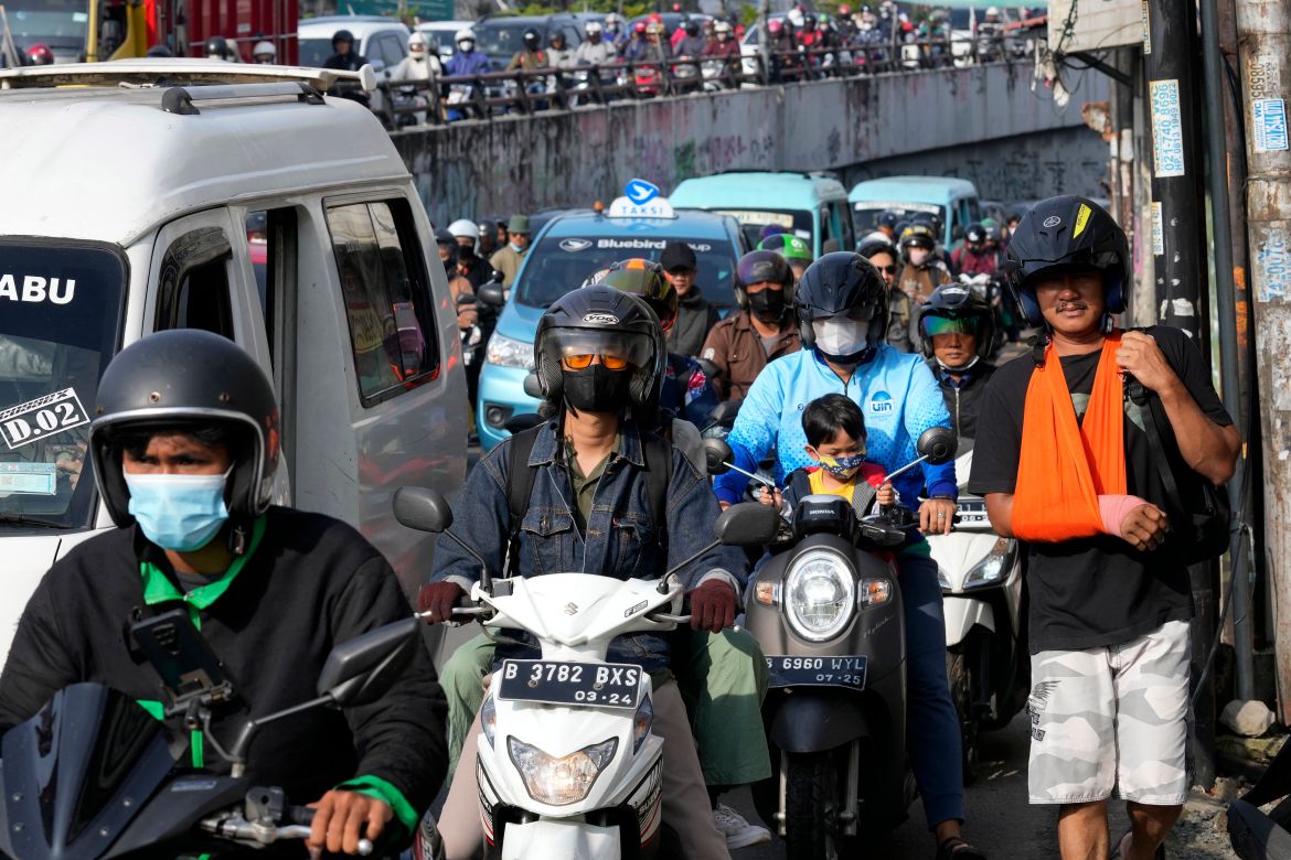 Motorists are stuck in the morning rush hour traffic in Jakarta,