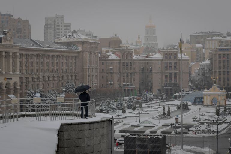 A man looks at the Independent Square (Maidan) in Kyiv, Ukraine, Monday, Nov. 21, 2022. People gathered to commemorate the Maidan protest movement and the events which took place in late Feb. 2014 that led to the departure of former Ukrainian President Victor Yanukovich and the formation of a new government. (AP Photo/Andrew Kravchenko)
