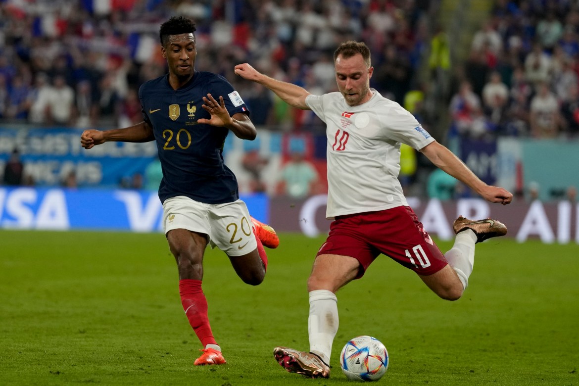 Christian Eriksen, right, and France's Kingsley Coman battle for the ball during the World Cup