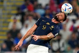 France's Olivier Giroud heads the ball during the World Cup group D soccer match between France and Denmark.