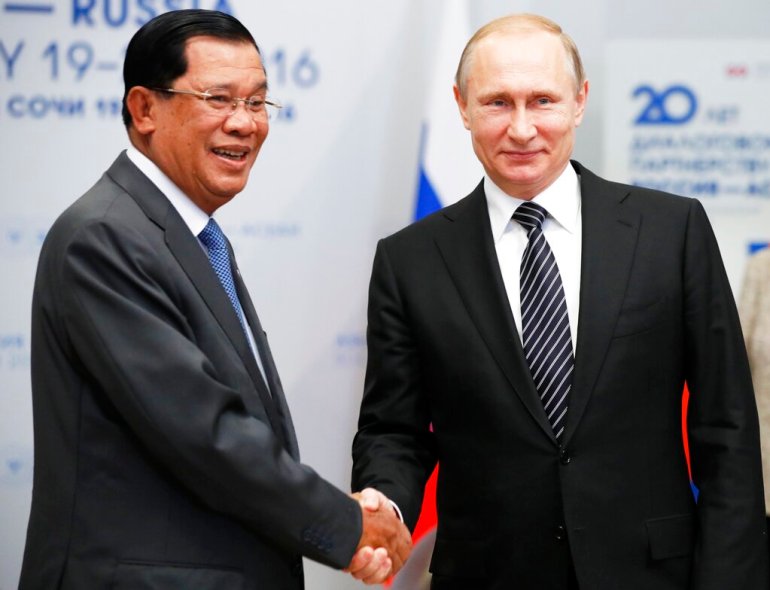 Russian President Vladimir Putin shakes hands with Cambodia's Prime Minister Hun Sen during their meeting at the ASEAN-Russia summit in Sochi, Russia.