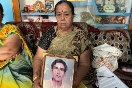 Shanti Devi holds a picture of her husband