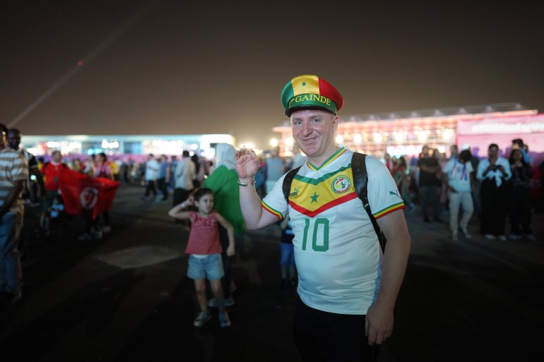 A fan wearing a Senegal jersey at the FIFA Fan Festival in Doha, Qatar