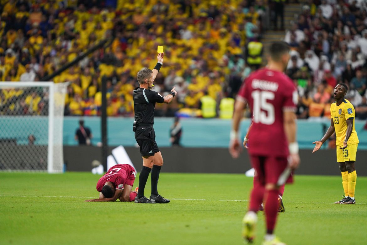 A fouled Qatari player on the ground