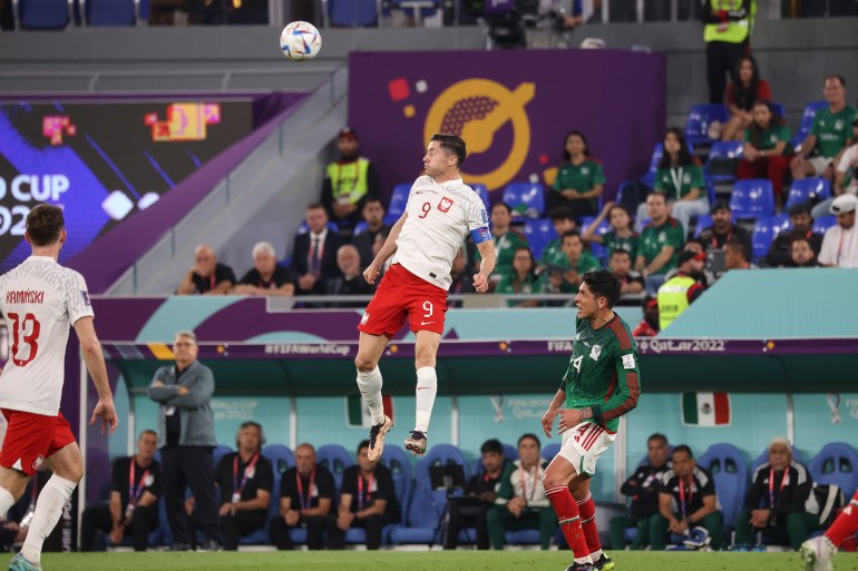 A Polish player flies high for header during the match against Mexico.