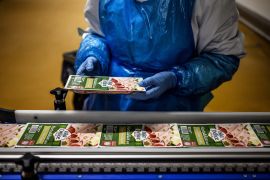 An employee works at the Isla Delice halal deli meat factory in Saint Andre sur Vieux Jonc, eastern France.