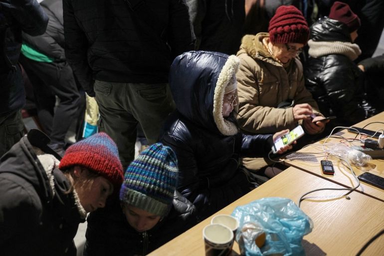 Residents charge their devices, use the internet and get warm at a ‘Point of Invincibility’ in Kherson, Ukraine.