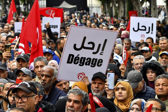 Tunisian demonstrators take part in a rally against President Kais Saied in Tunis, on December 10, 2022