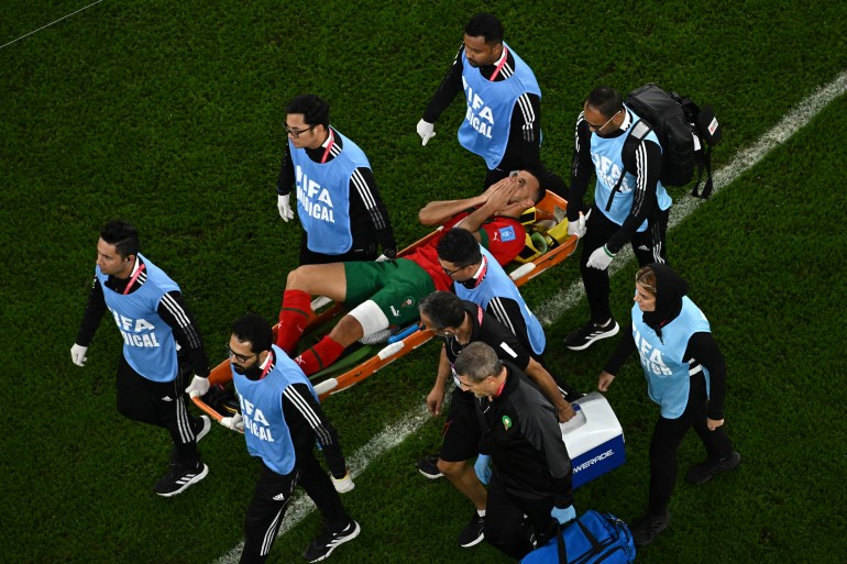 Morocco's defender #06 Romain Ghanem Saiss is carried away on a stretcher