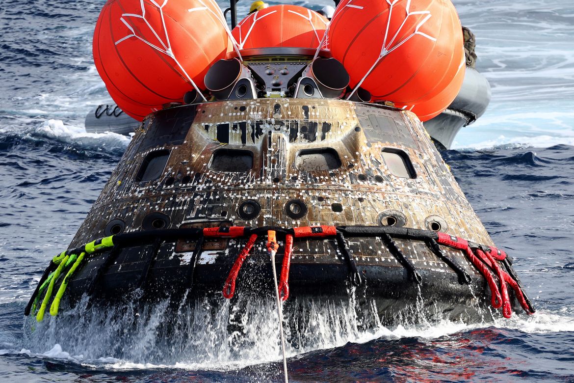 NASA's Orion Capsule is drawn to the well deck of the USS Portland
