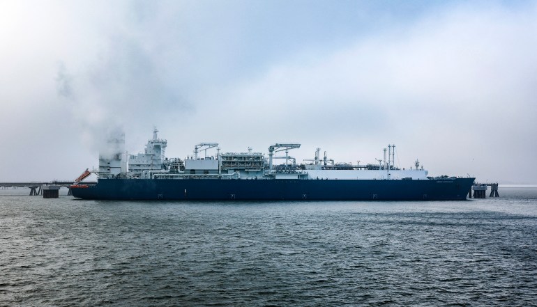 The Floating Storage and Regasification Unit (FSRU) ship 'Hoegh Esperanza' is docked during the opening ceremony of the Uniper Liquefied Natural Gas (LNG) terminal at the Jade Bight in Wilhelmshaven, northern Germany on December 17, 2022. - Germany on December 17 inaugurated its first liquefied natural gas (LNG) terminal, built in record time, as the country scrambles to adapt to life without Russian energy. (Photo by Axel Heimken / AFP)