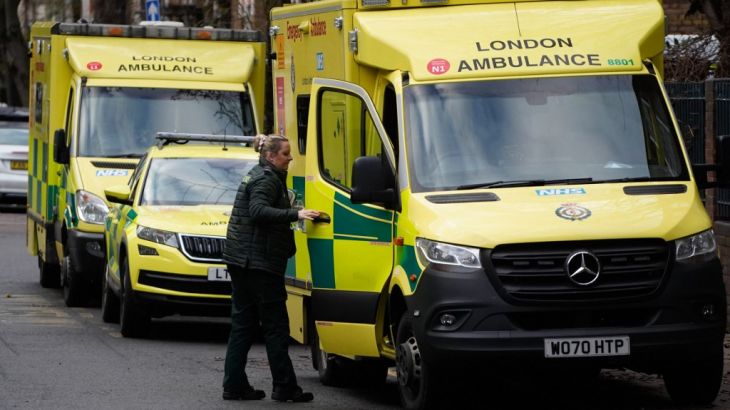 A paramedic shuts the door of an ambulance outside the Waterloo ambulance station in London
