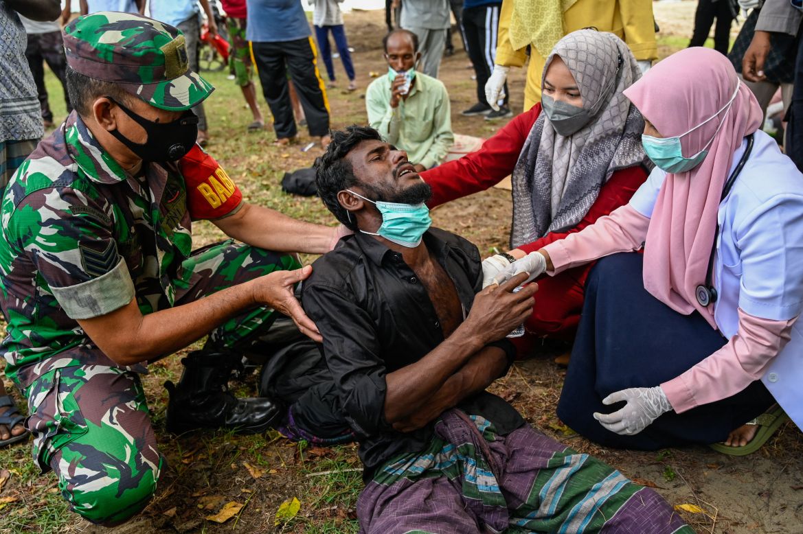 health workers check Rohingya in Indonesia